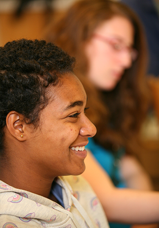 Smiling student in class